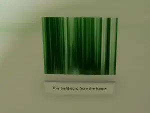 Bloomindaisy standing next to a green-striped note found at the mausoleum that says "This building is from the future."